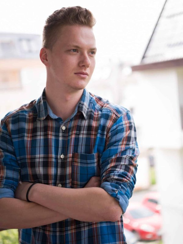 man-standing-at-balcony.jpg